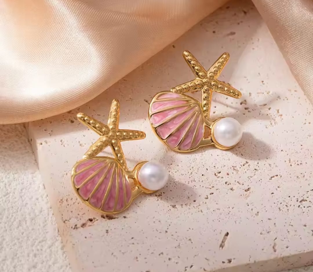 Aros de estrella y concha de mar en acero quirúrgico