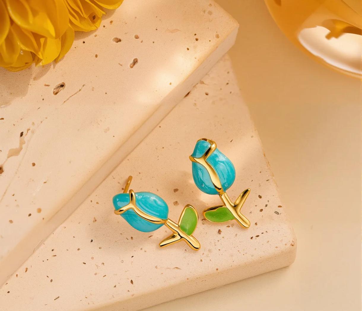Aros tulipán color celeste en acero quirúrgico